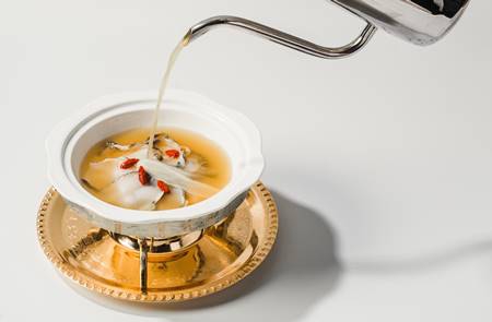 Sliced Fresh Abalone seared with Chicken Broth